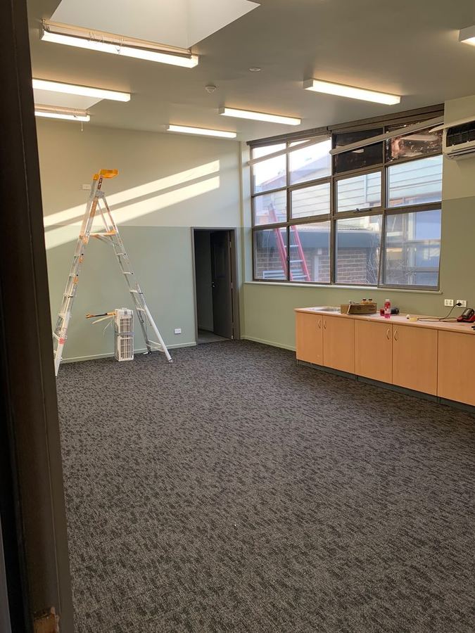 Clinic interior repaint in a calming two-tone green